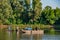 Danube island Å odroÅ¡ near Novi Sad, Serbia. Fishermans sitting in boat and holding fishing r